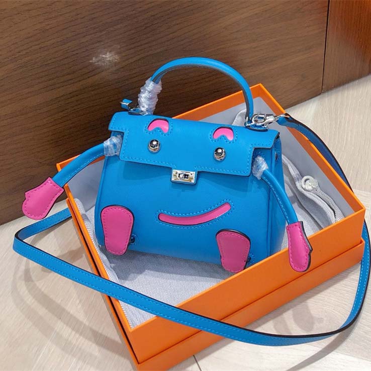 Smile Doll Bag Genuine Leather Mini Handbag with Top Handle and Crossbody Strap detail image 15
