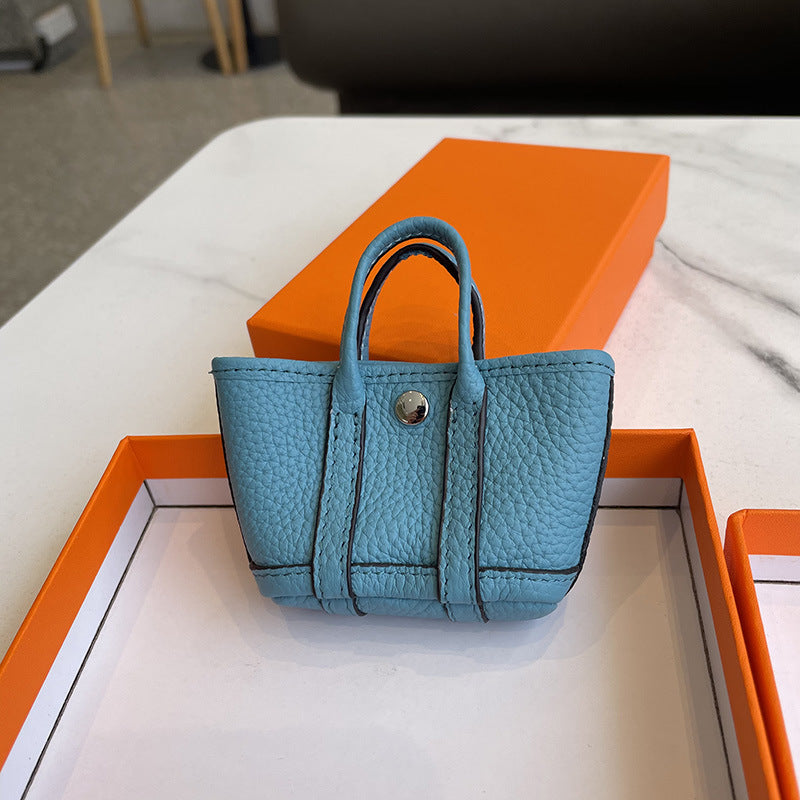 Mini Tote Bag Charm and AirPods Pro Holder in Top Grain Leather detail image 11