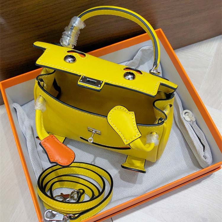 Smile Doll Bag Genuine Leather Mini Handbag with Top Handle and Crossbody Strap detail image 12